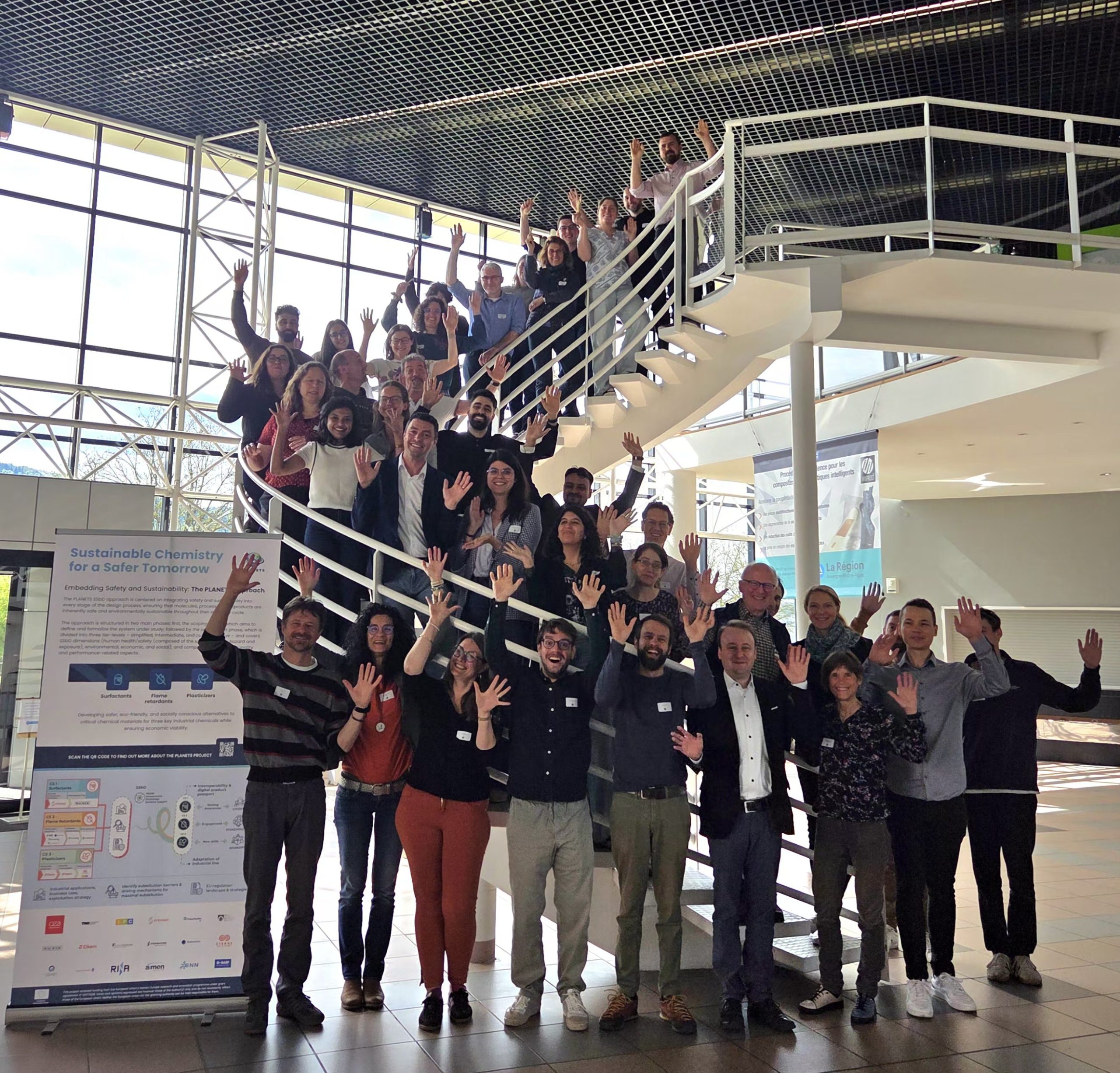 GroupPic_Indoors_Handsup_cut